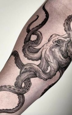 an octopus tattoo on the arm