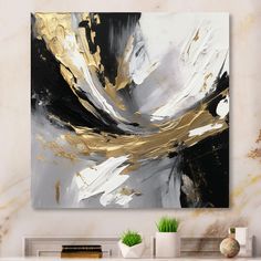 a white and black abstract painting on a wall above a fireplace mantel in a living room