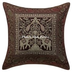 an embroidered pillow with elephants on it