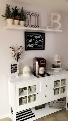 a white buffet table topped with lots of food