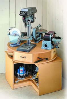 a sewing machine is sitting on top of a table with other items in the drawer