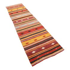 an orange and red striped rug on a white background with no one around it or someone else