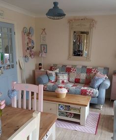 a living room filled with furniture and decor