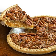 a pecan pie with one slice missing from it