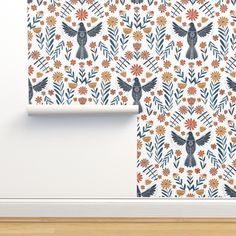 a wall with an owl and flowers pattern on it