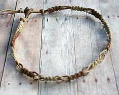 This handmade two-tone hemp necklace, woven in natural brown and beige, exudes a rustic beach vibe. Ideal for surfers and boho lovers, this eco-friendly piece is made from durable hemp, featuring a braided loop-and-bead closure. Embrace earthy, tribal style with this natural beach jewelry.Material: natural hemp in a single square knotting, fancy weave. Color: please chooseWidth: about 1cmLength: 14 inch or customClosure: braided loop and bead closure Sea Glass Crafts Jewellery, Silk Wrap Bracelets, Pride Necklace, Pride Jewellery, Celtic Necklace, Hemp Jewelry, Hemp Necklace, Hook Necklace, Surfer Bracelets