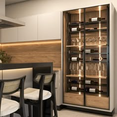 a wine cooler in the middle of a kitchen with two chairs and a table next to it