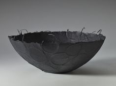 a black bowl sitting on top of a table