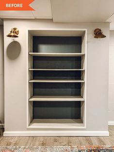 an empty bookcase in the corner of a room