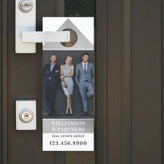 a door hanger with an image of two men and a woman in business attire