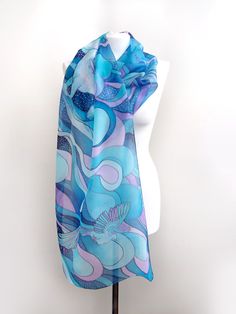 Hand painted scarf with Pegasus made of natural silk, in purple - blue - turquoise color set. This fantasy designer scarf is made to order. The Pegasus is a magical creature, a winged horse symbolizing wisdom and fame and more recently poets' inspiration (so imagine what a lovely gift the scarf would made for your poet friend). The Pegasus scarf depicts the winged horse flying with two peacocks on a starry, cloudy night sky. It is composed with tones of cool blue and turquoise, soft pastel mint Elegant Hand Painted Blue Silk Scarf, Elegant Hand Painted Blue Scarves, Elegant Blue Hand Painted Scarves, Blue Hand Painted Silk Scarf, Blue Hand Painted Bohemian Silk Scarf, Bohemian Blue Silk Scarf Gift, Bohemian Blue Silk Scarf As Gift, Bohemian Blue Silk Scarf For Gift, Blue Bohemian Hand Painted Silk Scarf