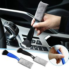 two brushes are being used to clean the interior of a car