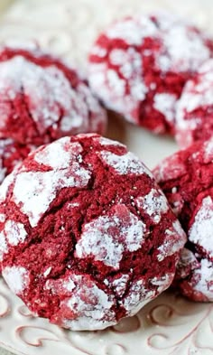 red velvet cookies on a plate with powdered sugar