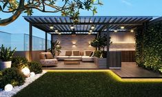 an outdoor living area with furniture and lighting