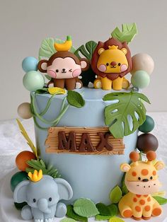 there is a cake decorated with animals and letters