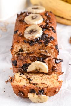 a loaf of banana bread with chocolate chips and sliced bananas