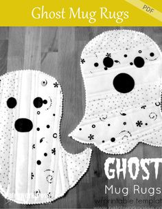 two white ghost mug rugs with black dots on them