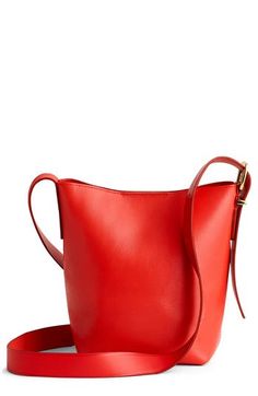 Madewell's newest leather bag collection is cool, modern and quietly luxe. With a magnetic closure and interior pocket, the mini bucket tote is perfectly sized to hold your phone, wallet, keys and more—plus, it has a shoulder strap and adjustable crossbody strap. It's so good, it's essential. Structured silhouette with flat base for stability Leather Imported