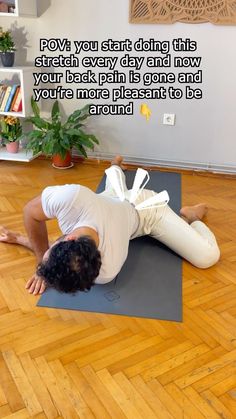 a man is doing yoga on a mat