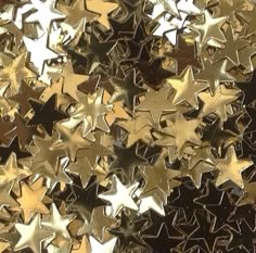 gold and black stars are scattered together