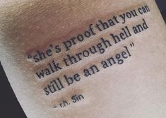 a tattoo saying she's proof that you can walk through hell and still be an angel