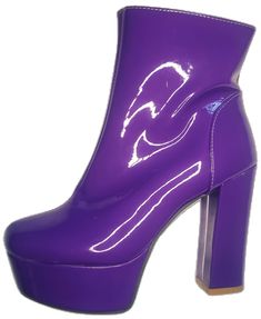 Retro Boots For Spring Party, Retro Spring Party Boots, Retro Platform Boots For Party, Bold Round Toe Platform Boots For Party, Fall Purple Platform Boots, Retro Heeled Boots For Party In Fall, Trendy Purple Platform Boots, Bold Party Boots With Block Heel, Bold Block Heel Party Boots