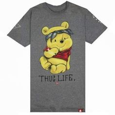 a grey t - shirt with a cartoon winnie the pooh on it's chest