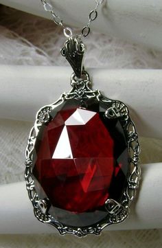 "Red Garnet Cubic Zirconia (CZ) Pendant Bubble Design#P10 Custom Made Inspired by Victorian era designs, this lovely Antique reproduction is lovingly hand-crafted in sterling silver. The flawless 22 carat faceted red garnet CZ is 24mm x 18mm. The entire pendant is 1.5\" long and 7/8\" wide. The chain (if chosen) is adjustable between 18-20\". The necklace is marked 925 for sterling silver. Notice the beautiful craftsmanship of the vintage filigree setting. This pendant necklace is a fantastic re Red Gothic Necklace For Formal Occasions, Formal Red Garnet Jewelry, Antique Jeweled Red Jewelry, Elegant Red Jeweled Necklace, Red Ruby Victorian Necklace, Red Oval Victorian Necklace, Ornate Red Garnet Jewelry, Party Red Necklace With Intricate Design, Red Necklace With Intricate Design For Party