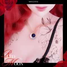 a woman with red hair and tattoos wearing a black bra holding a blue eye necklace