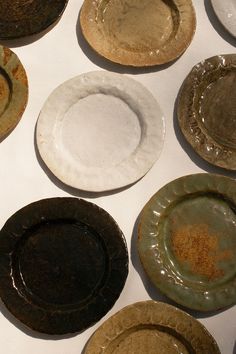 several dirty plates sitting on top of a white table