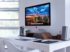 a desktop computer sitting on top of a white desk