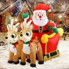 an inflatable christmas scene with santa and reindeers