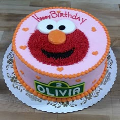 a birthday cake with an elmo face on it