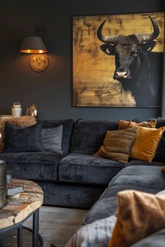 a living room filled with furniture and a painting on the wall above it's couch