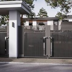 an image of a gate that is in front of a house