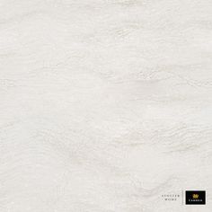 a white marble textured wallpaper with black and gold lettering on the left side