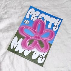 a greeting card with a pink flower on it