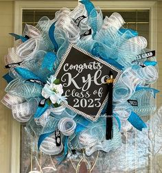 It's that time of year for graduation. How about a custom, made to order wreath for your front door or graduation party. Made with your color choice mesh, ribbon and highlighted with a blinged out graduation cap with a tassel. Customize your wording on the cap.  These wreaths are made to order, if your interested in doing a split color wreath i.e high school and college of choice feel free to send me a message or add to the note section.  Add your wording in the note section pictures are from previous years, your wreath will show the current year Graduation Wreath, Front Door Swag, Fall Swags, Butterflies Wreath, Purple Wreath, Pink Wreath, Mesh Ribbon, Wreath Front Door, Welcome Wreath