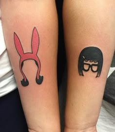 two people with matching tattoos on their arms, one has a bunny and the other has a man's face