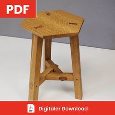 a small wooden stool sitting on top of a white table