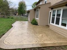 a concrete patio in front of a house