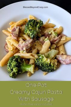 one pot creamy cajun pasta with sausage and broccoli on a white plate