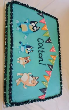 a sheet cake decorated with cartoon characters on it