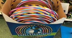 a box filled with lots of different colored hoses