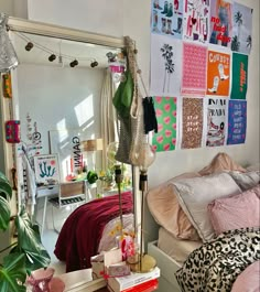 a bed room with a neatly made bed and a large mirror