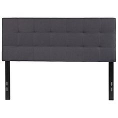 an upholstered headboard with metal legs and buttons on the bottom, in grey fabric