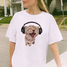 Rock this meow-mazing white T-shirt with a purr-fectly adorable cat in headphones. Made with 100% cotton, it's the most paw-some addition to your wardrobe. Y2K, trendy, and aesthetically twisted! Cute Cat With Headphones, Cat Wearing Headphones, Cat With Headphones, Headphones White, Wearing Headphones, Wearing Headphone, White Headphones, Themed Outfits, Cat Theme