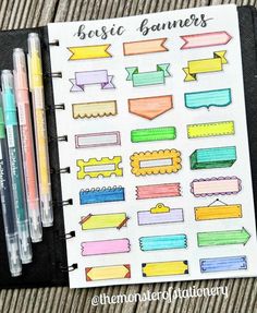 a notebook with some markers and pens on it