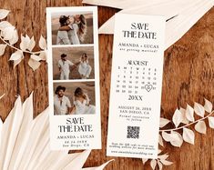 save the date photo bookmarks on a wooden table with feathers and leaves around them