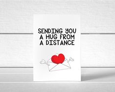 a greeting card with the words sending you a hug from a distance written on it